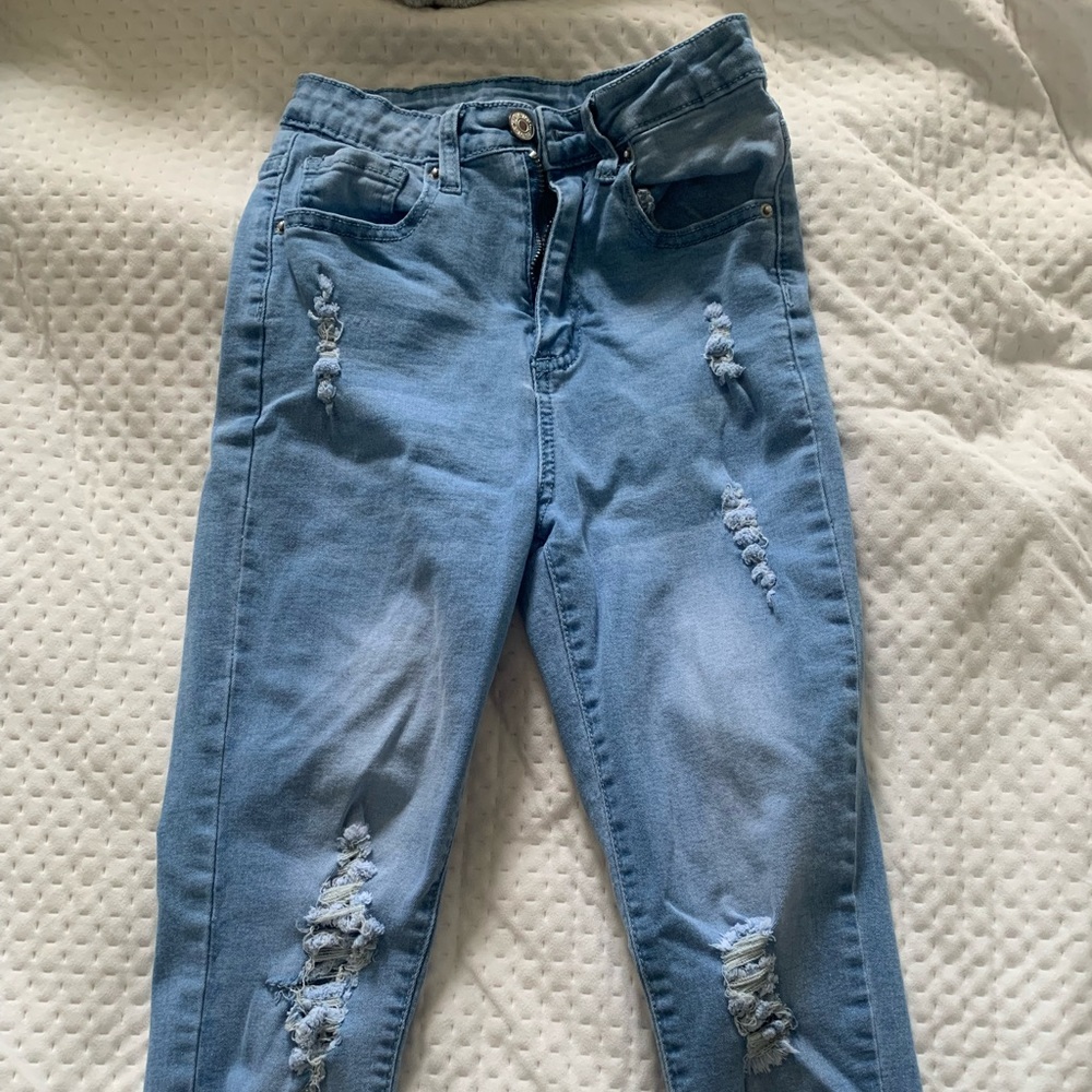Blue high waisted skinny jeans with rips